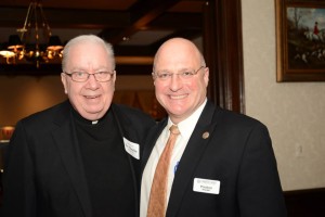 Fr. Charles Bolser, CSV, a former president poses with current president, Preston Kendall