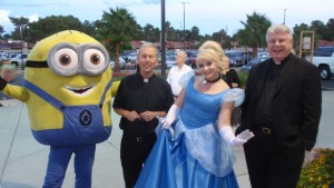 Fr. Richard Rinn, left, and Fr. Larry Lentz mix it up with a minion from Despicable Me and Cinderella