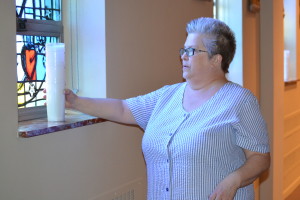 Viatorian Associate Karen Cutler prepares the chapel at Saint Viator High School for Taizé prayer 