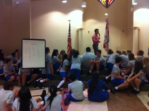 Inspirational speaker, James Silvas, addresses eighth graders during an opening retreat