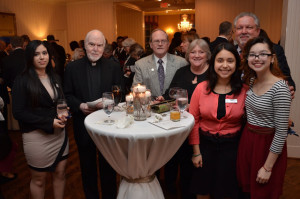 Fr. John Milton, Br. Dan Lydon, and Associates Tim and Donna Schwarz enjoy visiting with students