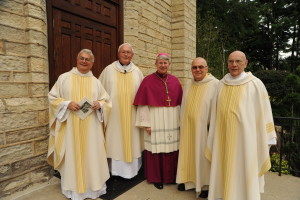 Bishop Daniel Conlon, center, joins Fr. Richard Pighini, pastor, at left, and the three jubilarians: Fr. Bill Haesaert, Fr. Tom Kass and Fr. John Eck. Photo by David Merkle 
