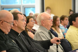 The school's first president, Br. Leo Ryan, center, enjoys the festivities