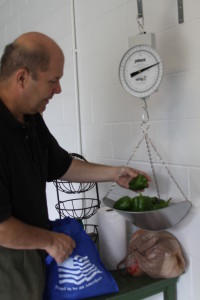 Pre-Associate John Dussman weighs some of his harvest