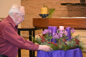 Br. Don Houde, CSV, prepares the Advent wreath in the Province Center chapel