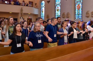 Meredith, fourth from left, participates in a daily Mass during VYC