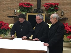 Br. Peter Lamick signs his vows before Fr. Thomas von Behren, provincial, and Fr. Arnold Perham, assistant novice director