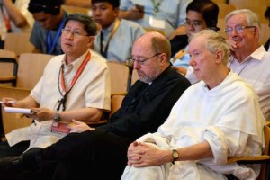 From left, Cardinal Luis Antonio Tagle of Manila, Father Mark Francis, president of the Catholic Theological University in Chicago and Dominican Father Timothy Radcliffe listen to a speaker during the second day of the theological symposium in Cebu on Jan. 21. (Photo courtesy of CBCP)