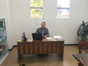 Br. William Pardo, CSV, director of the Diploma Program in his office