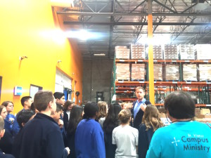 Students tour the massive food distribution warehouse