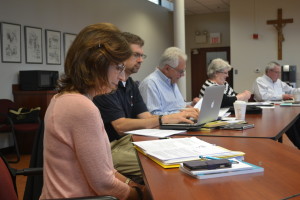 Associate Juliann Dwyer, Br. John Eustice, CSV, and Associates Randy Baker and Marilyn Mulcahy take their seats with the VCC, advising Fr. Thomas von Behren, provincial, far right