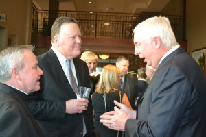 Fr. Thomas von Behren, CSV, left, and incoming president, Brian Liedlich, center, discuss the school with Jack Klues, a member of its advancement committee