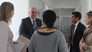 Fr. Albeyro Vanegas, CSV, rector of the school, shows officials from the IB accreditation team around the school