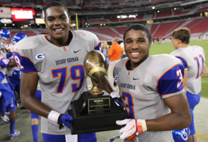 Ronnie Stanley and his Bishop Gorman teammate, Shaq Powell, hold up the state trophy