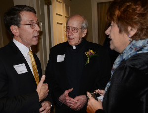 Fr. Arnold Perham, CSV, center, with Arlington Heights Mayor Tom Hayes, left, and Saint Viator Principal Eileen Manno at the Hearts of Gold dinner in 2015.