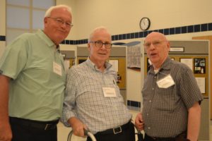 Fr. William Haesaert, left, Fr. Robert Bolser, center, and Fr. John Eck enjoy catching up 