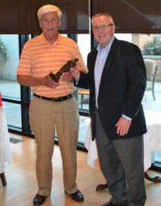 Fr. Michael Keliher accepting a gift from Fr. Thomas von Behren, CSV, at a celebration last summer for all the Viatorian jubilarians