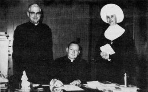 Fr. Ed Anderson, CSV, center, joined the administrative team at Bishop Gorman High School in 1966, with Fr. Philip Clifford, CSV, left, and Sr. Irmalyn, CSV, vice principal