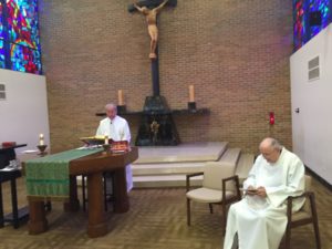 Fr. Simon Lefebvre, left, and Fr. James Crilly, right, concelebrate their 60th jubilee Mass