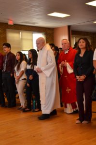 Fr. John Milton, CSV, followed by Fr. Thomas von Behren, CSV, process into Mass