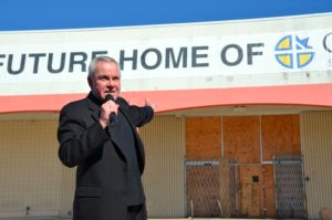 Fr. Thomas von Behren, CSV, speaks during the unveiling of the new campus for Cristo Rey St. Martin College Prep