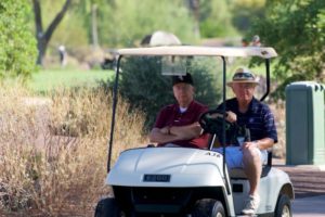 Fr. Charles Bolser, CSV, observing match play with Head Coach Jack Halpin