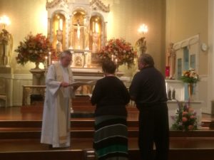 Fr. Thomas von Behren accepts the definitive commitments of Associates Michelle and Ken Barrie