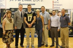 From L-R: Mrs. Eileen Manno, principal, Mr. Brian Liedlich, president, Kmet, his parents Kandace and Frank Kmet, and Martin Jennings, athletic director