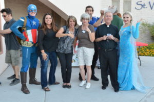 Fr. Richard Rinn, right, and Associate Rosy Hartz, second from left, with celebrities