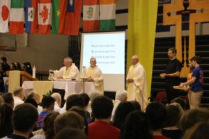 Fr. Thomas von Behren celebrates Mass on St. Viator day at Saint Viator High School, with Fr. Dan Lydon, left and Fr. Dan Hall