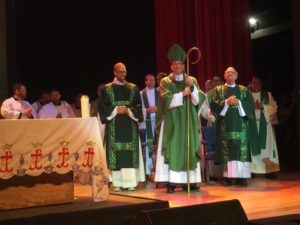 Bishop Joseph Brennan leads the procession into Mass