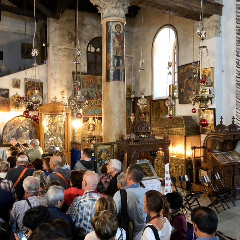 crowd heads down to the cave at church of nativity